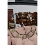 An oversized metal frame wall clock, diameter approx. 122cm