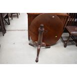 A 19th Century circular tripod table on turned column and triple splay legs, diameter approx.