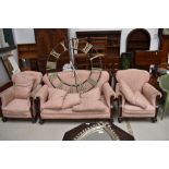An early 20th Century three piece lounge suite having mahogany frame, good sound frame, some