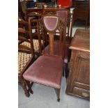 A pair of Edwardian mahogany and inlaid salon chairs having dralon seat and shoulder pad, on