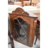 A 19th Century oak corner wall display cabinet