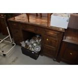 An early to mid 20th Century al desk having leather top