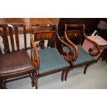 A pair of reproduction scroll carver chairs