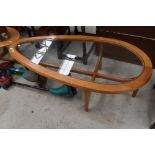 A vintage teak teardrop coffee table