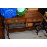 A Victorian mahogany washstand having solid top over two frieze drawers