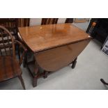 A mid to late 20th Century oak gateleg dining table, width approx. 98cm