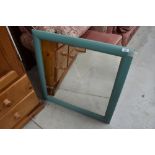 A modern painted wall mirror, approx. 70 x 70cm