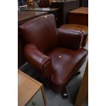 A vintage leather swivel chair, suitable for office or living space, in fashionable brown leather on