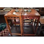 A pair of Oriental hardwood occasional tables