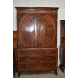 An Edwardian mahogany and satinwood banded linen press, wardobe upper section over three long drawer