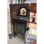 A Victorian ebonised boudoir cabinet, having glazed and fretwork section and mirror back, width