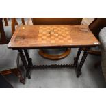 A Victorian chequer board table , having bobbin turned frame and stretcher