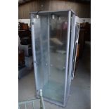 A glass fronted display cabinet with integral light