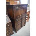 A stained oak cupboard in a traditional design