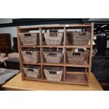 A modern pine 9 compartment storage unit, with 8 baskets, approx. dimensions W84cm H69cm D31cm