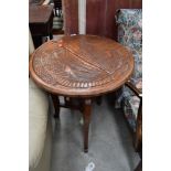 A folding carved table, mythical creature decoration, approx. diameter 60cm