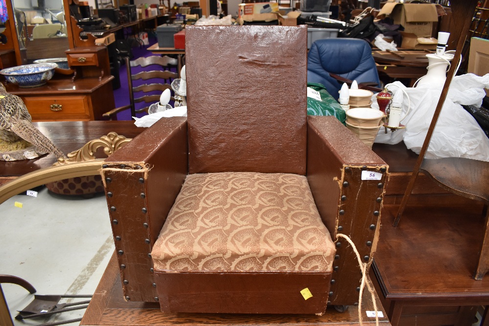 A 1930s childs armchair of Art Deco design, studded leather decoration, width approx. 51cm