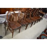 A set of six (four plus two) dark stained Ercol style kitchen dining chairs