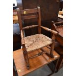 A period oak childs rocking chair having sea grass seat, signs of past worm but not active