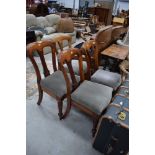 A set of four Victorian mahogany dining chairs, having later green dralon seats