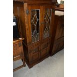 A leaded glass and oak display cabinet by Old Charm 54cm wide 114cm tall and 49cm deep