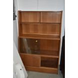 A vintage golden oak bookself having glazed and cupboard sections, width approx. 91cm