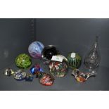 A lot of eleven paper weights including Mdina glass.