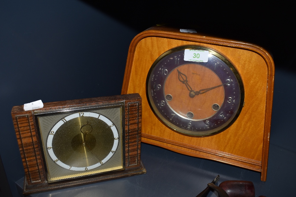 Two vintage wooden mantel clocks the large one being Smiths and having chiming mechanism.