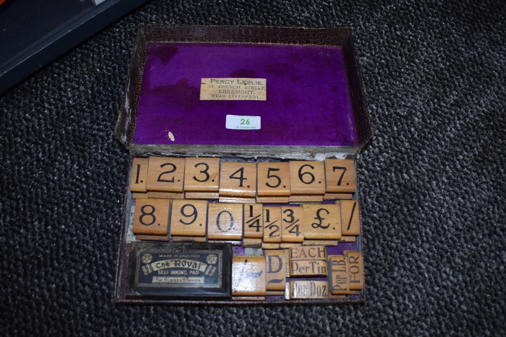 A Early 20th century shop or store printing block set, included are numbers, fractions and weights