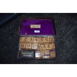 A Early 20th century shop or store printing block set, included are numbers, fractions and weights