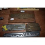 Four metal engineering/machinery signs and badges.