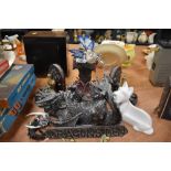 A collection of dragon ornaments, book ends and similar, seven items in total.