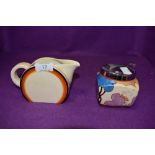 Two 'Bizzare' by Clarice Cliff items, a jug measuring approx 9.5cm in height, and a sugar bowl