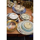 An assortment of vintage and modern plates, including Royal Worcester and more.