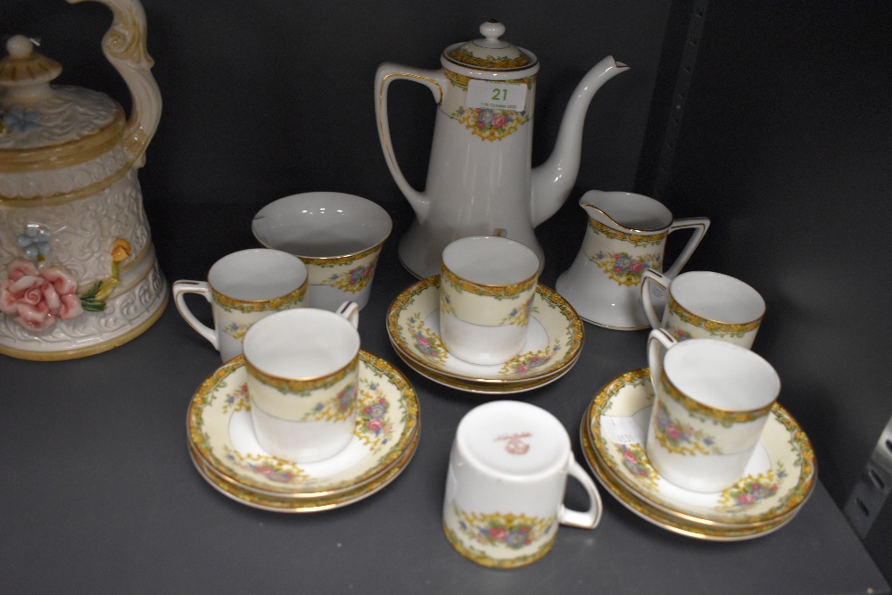 A Noritake part coffee set comprising of six cups and saucers,sugar basin, creamer and coffee pot,