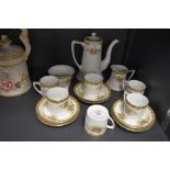 A Noritake part coffee set comprising of six cups and saucers,sugar basin, creamer and coffee pot,