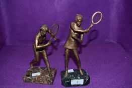 Two bronze cast figures of tennis players Virginia Wade and Christine Truman on marble bases