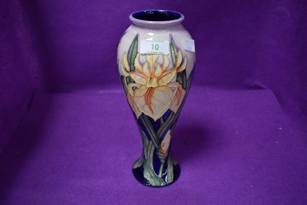 A Moorcroft baluster vase,having tube lined iris design in yellow on pink and blue ground designed