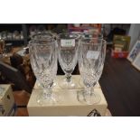 A set of five Waterford crystal wine glasses with box.