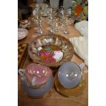 A selection of vintage Babycham advertising glasses and harleqin Arcopal tea cups and saucers