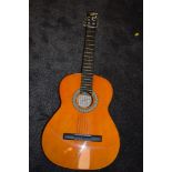 A Spanish style C-giant acoustic guitar.