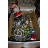 A selection of vintage Christmas decorations including novelty Santa