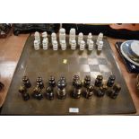 An unusually designed chess set with Bauhaus or art deco design ceramic with white and lustre glazes