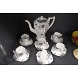 A Shelley 'Black leafy trees' part coffee service comprising of six Queen Anne shaped cups,six