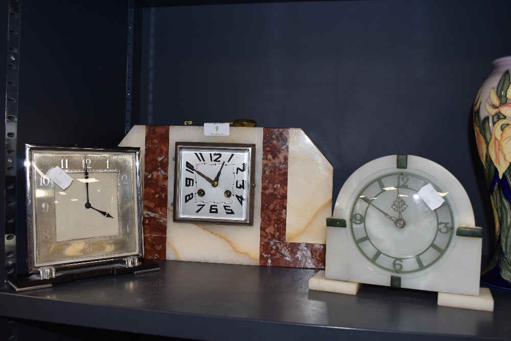 Three Art deco mantel clocks, two of which are Smiths, the larger marble one possibly European.