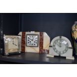 Three Art deco mantel clocks, two of which are Smiths, the larger marble one possibly European.