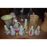 A selection of cruet sets and salt and peppers including hand decorated