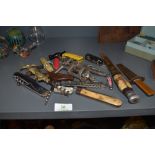 A collection of pocket vintage and retro knives and bottle openers,corkscrews and similar.