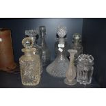 Six vintage pressed glass decanters or varying size and style and similar items, good condition.
