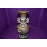 A large and imposing oriental vase possibly Japanese with earthen ceramic body decorated with